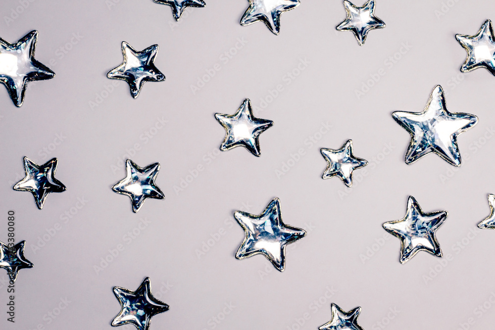 Shining silver stars on white background. Copy space. Shining silver stars on white background. Copy space.