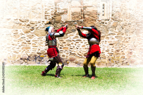 Fight Scene Between Two Brave Medieval Knights At Daylight, Stone Wall Background