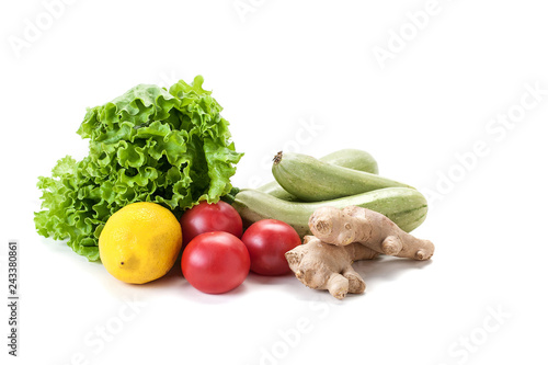 fresh vegetables and lettuce on white background