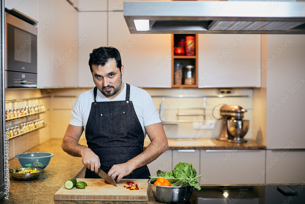 Middle aged man in the kitchen at home Middle aged man in the kitchen at home