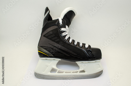 black hockey skates, isolated, white background, closeup