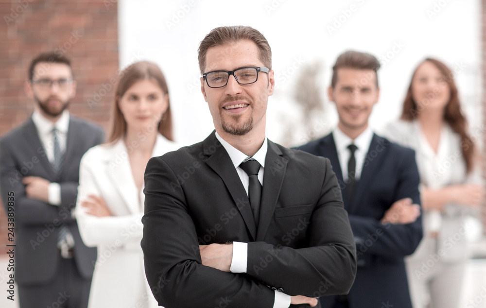 confident businessman in front of his business team. confident businessman in front of his business team.