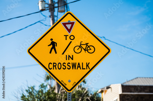 Share the Road - yellow waring sign, bicyclist and pedestrians crossing 