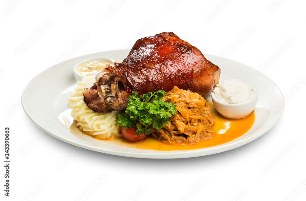 baked leg of lamb with sauces and a runner of stewed cabbage and mashed potatoes