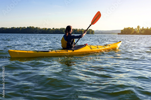 girl on a kayak on the river