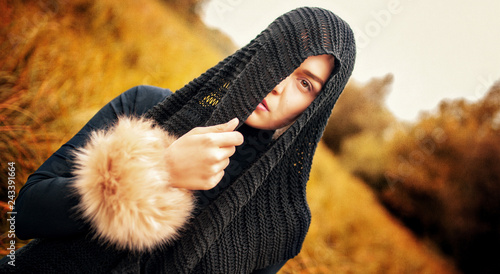 Wallpaper Mural Beautiful girl portrait with half of her face covered with head scarf. Textured background with grain for the fine art style. Torontodigital.ca