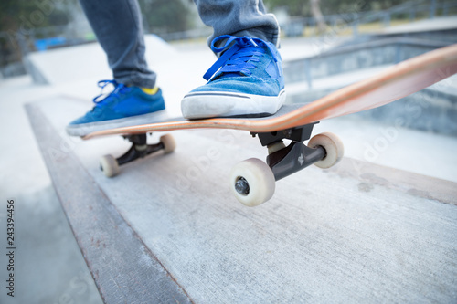 skateboarding legs riding skateboard at skatepark