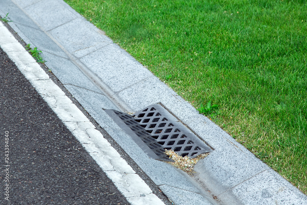 Street Gutter Of A Stormwater Drainage System On The Side Of An Asphalt 