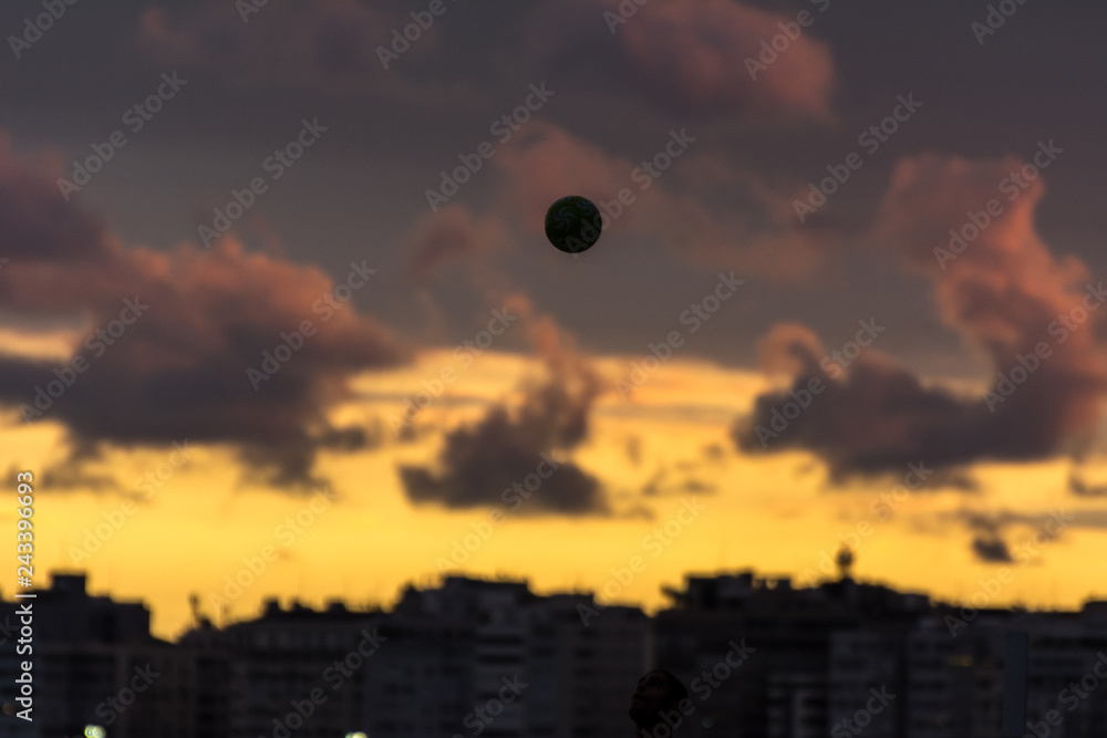 People playing football at the beach at the sunset, in Copacabana, Rio de Janeiro, Brazil. People playing football at the beach at the sunset, in Copacabana, Rio de Janeiro, Brazil.
