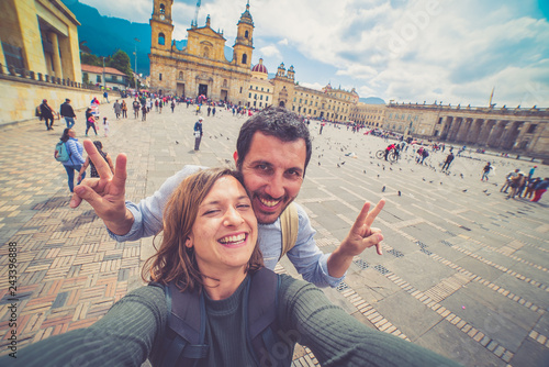 Happy young man taking a selfie photo in Bogota, Colombia. in the main square of the city called Bolivar square