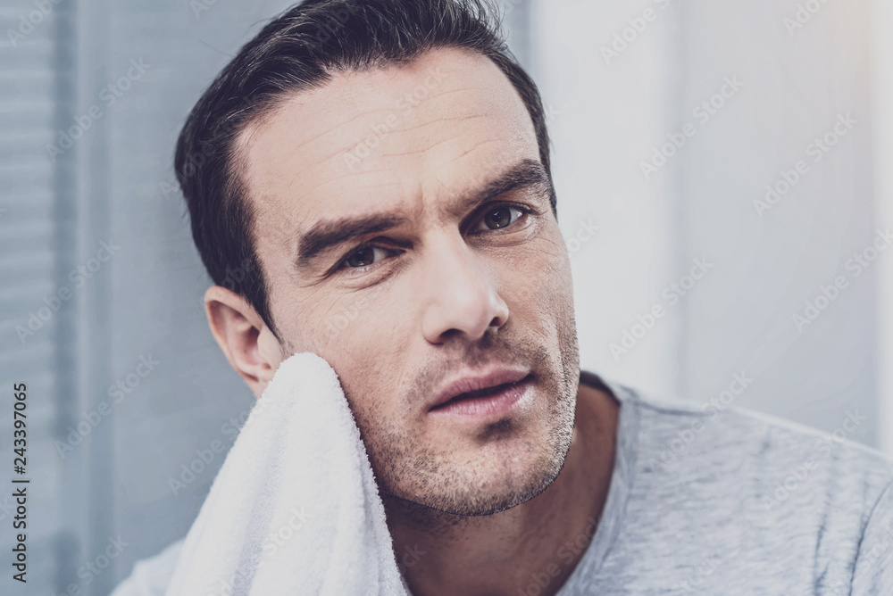 Fototapeta premium Close up of brunette man that looking at camera