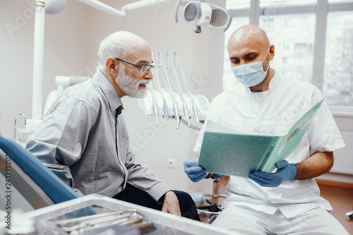 Old man sitting in the dentist s office