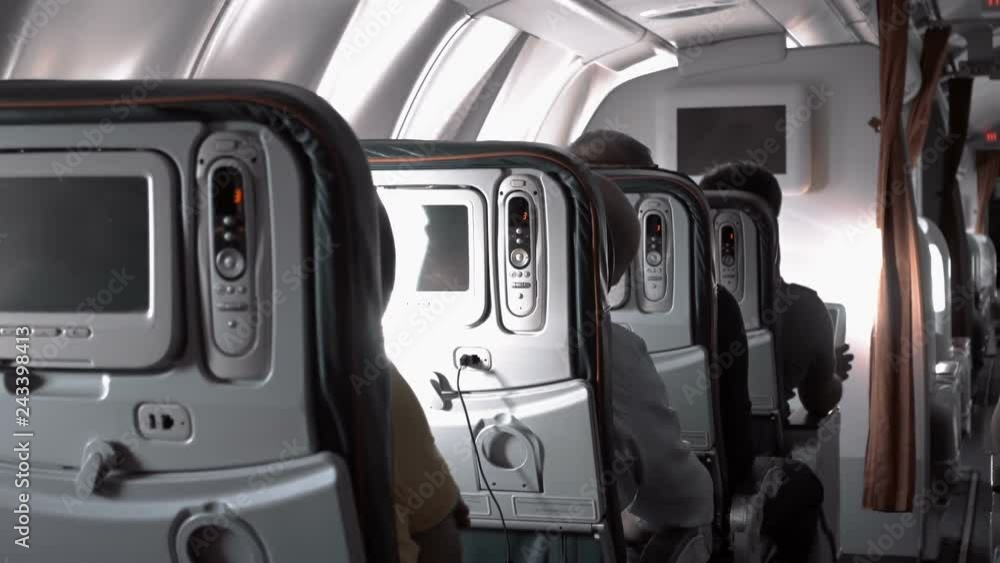 In the cabin, passengers in the monitor can watch the land over which they fly in real time. The sunbeam moves through the cabin from the window In the cabin, passengers in the monitor can watch the land over which they fly in real time. The sunbeam moves through the cabin from the window