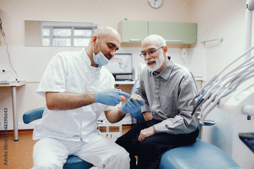 Old man sitting in the dentist's office Old man sitting in the dentist's office