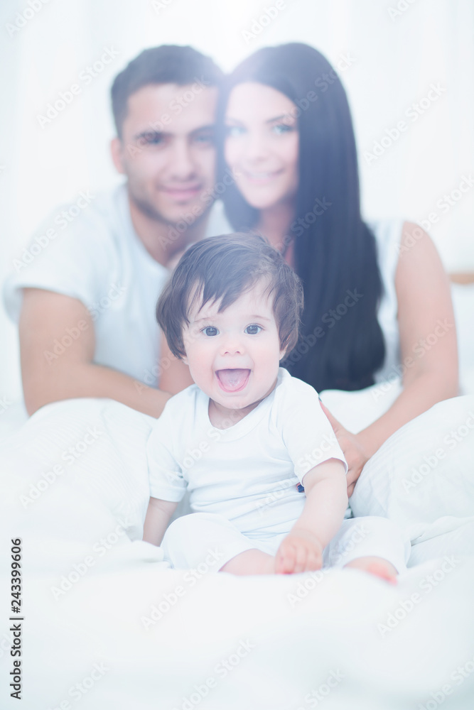 Portrait of happy young  family isolated on white