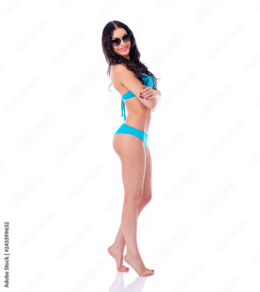 Obraz premium Beautiful brunette woman in turquoise swimsuit