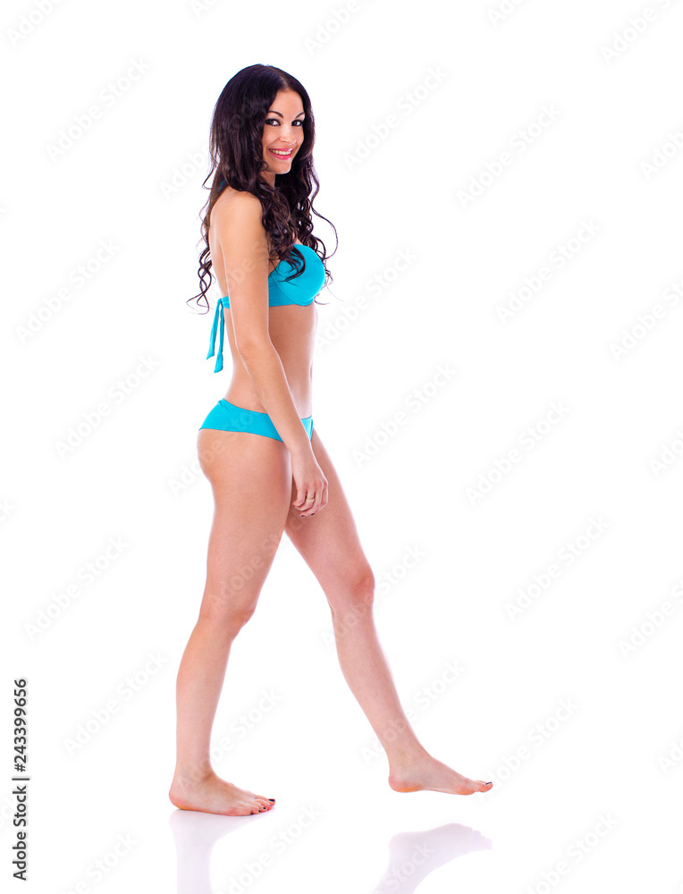 Portrait of young brunette woman wearing turquoise bikini Portrait of young brunette woman wearing turquoise bikini