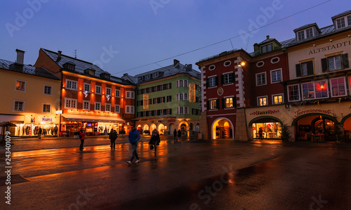 5 January 2019, Lienz (Austria): Christmas decorations on the Hauptplatz square at evening. People walking through the square photo