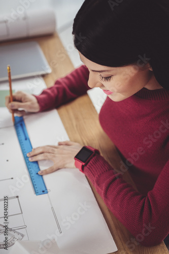 Smart female engineer focusing on work