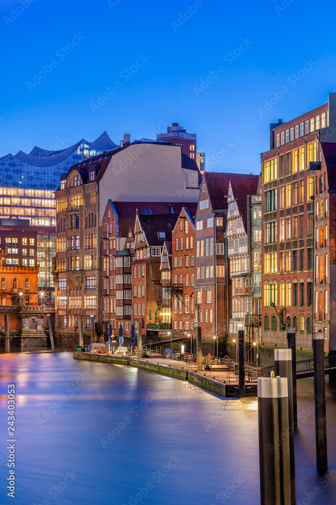 The Nikolaifleet in Hamburg, Germany, at dusk. It is a canal in the old town (Altstadt) and is considered one of the oldest parts of the Port of Hamburg.