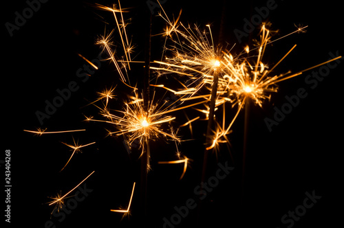 Light sparklers on holiday glare sparks texture background