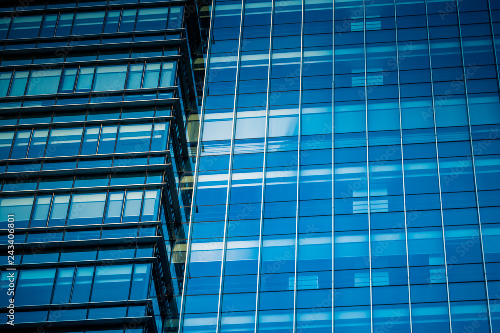 Obraz premium background of the glass modern office building.