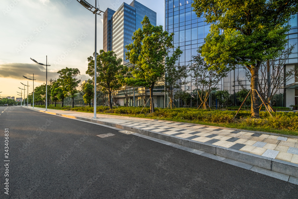 Fototapeta premium Empty asphalt road through modern city in Shanghai, China