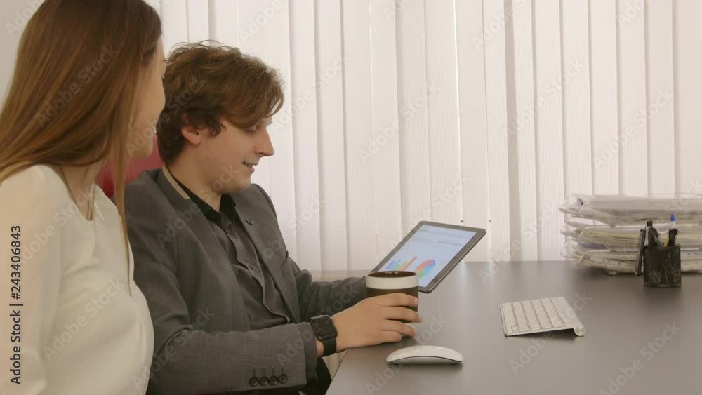 Creative group of young business people, employees working on a project. Founders of startup created a new idea. Group of business men and women using computer, tablet, notebook on meeting. Teamwork. Creative group of young business people, employees working on a project. Founders of startup created a new idea. Group of business men and women using computer, tablet, notebook on meeting. Teamwork.