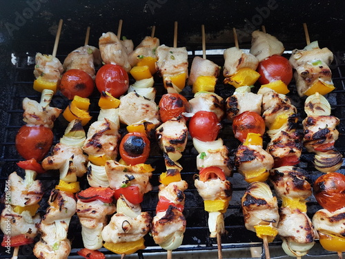 Roasting Frigarui ,skewers,on an outdoors grill photo