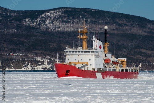 Canadian Coast Guard icebreaker at work in the Bay of  Gaspe, Quebec, Canada. 