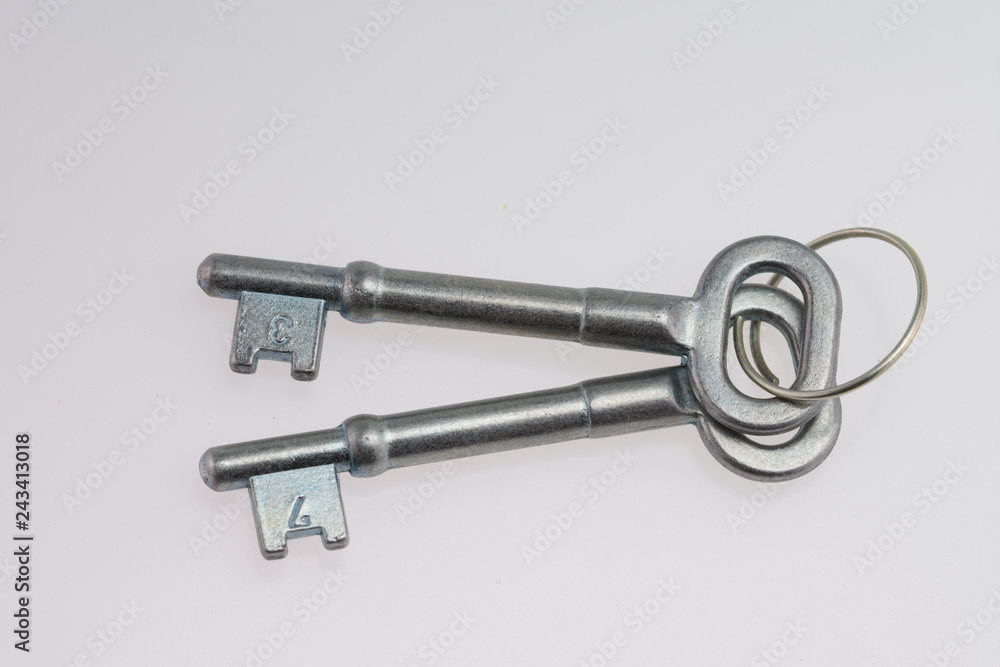 An Old-Fashioned Key on a White Background An Old-Fashioned Key on a White Background