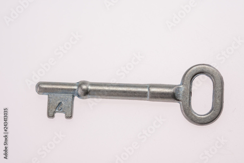 An Old-Fashioned Key on a White Background © Laurenx