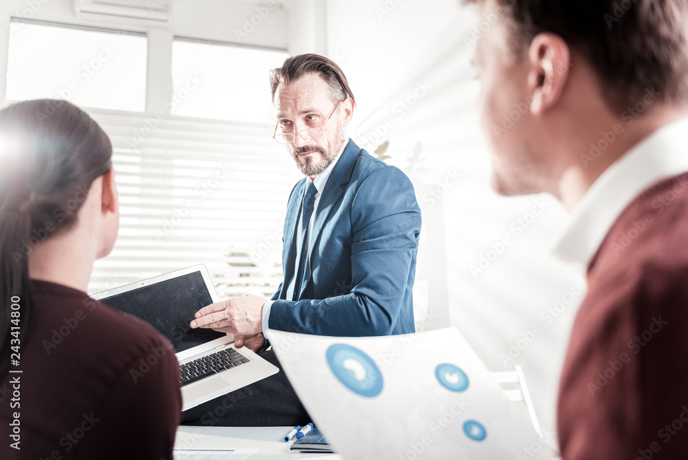 Worried male boss explaining errors Worried male boss explaining errors