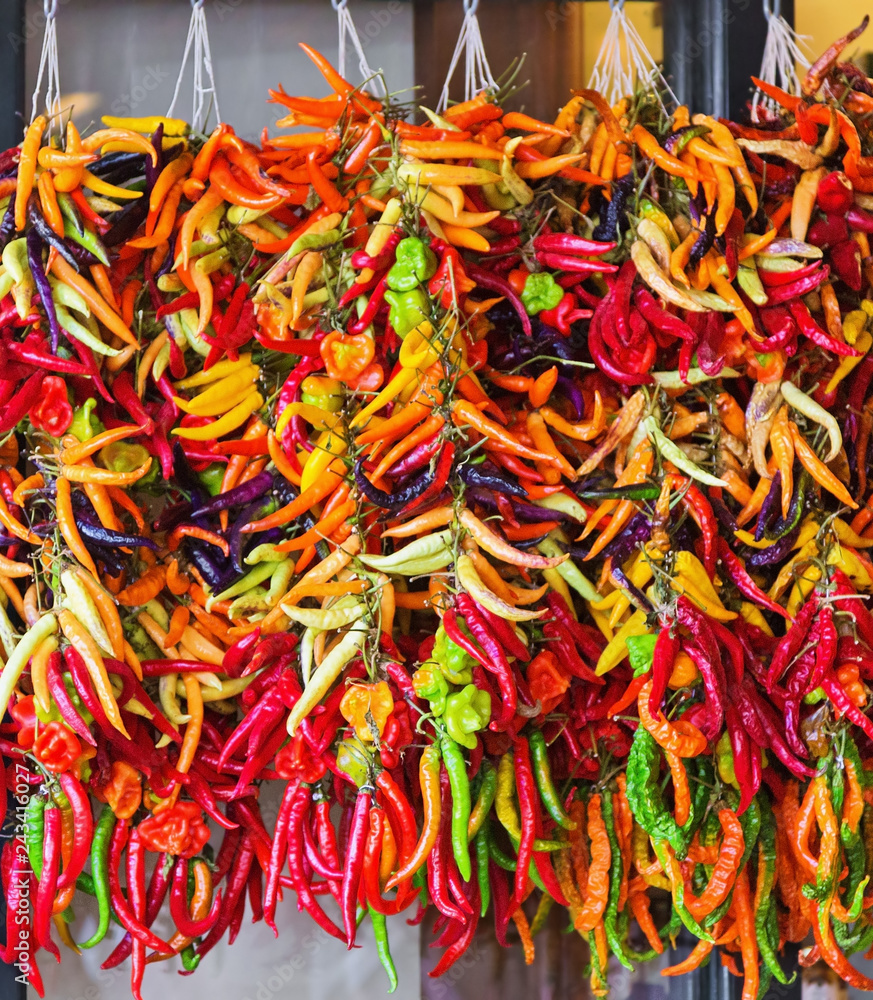 bunches of red, green and yellow hot peppers