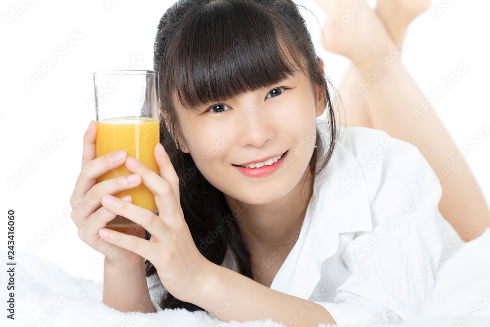Chinese woman drinking orange juice isolated on white background Chinese woman drinking orange juice isolated on white background