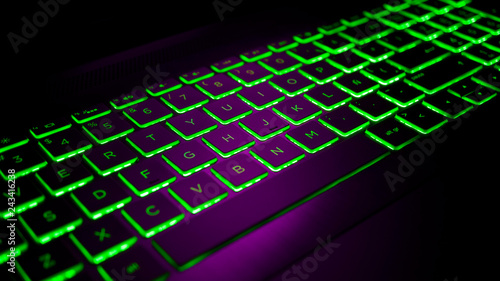 Gamer keyboard Purple and Green backlight, modern laptop computer