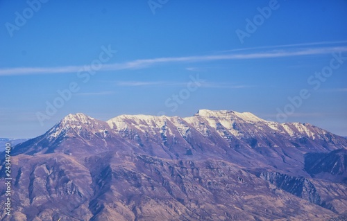 Aerial view of Wasatch Front Rocky Mountain landscapes on flight over Colorado and Utah during winter. Grand sweeping views near the Great Salt Lake, Utah Lake, Provo, Timpanogos, Lone and Twin Peaks  photo