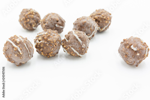Chocolate ball isolated on white background, Sugared hazelnut dragees in chocolate.