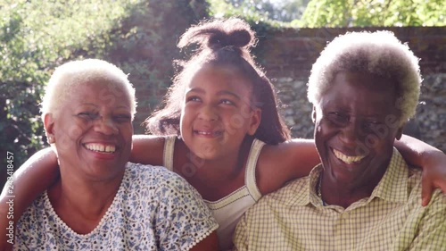 Senior black couple and granddaugther outdoors, close up photo