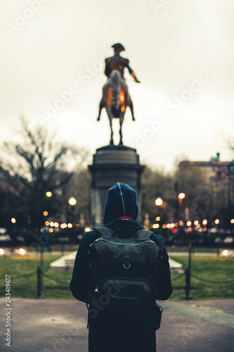 Man in Sweatshirt Looks at George Washington Statue in Boston
