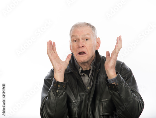 Unhappy, disbelieving, skeptical, doubtful older man isolated on white background