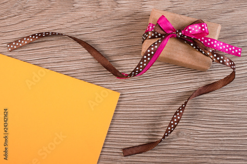 Gift with ribbon and love letter for Valentines Day