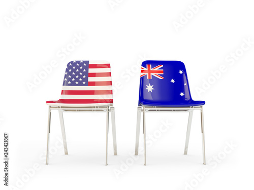 Two chairs with flags of US and australia isolated on white