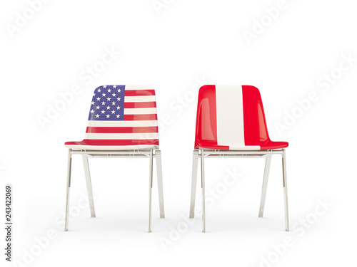 Two chairs with flags of US and peru isolated on white