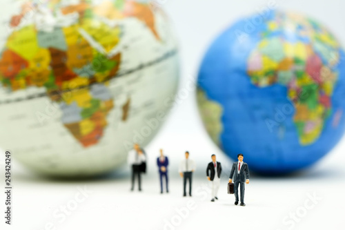 Miniature people : Businessman team with miniworld ,International business concept.