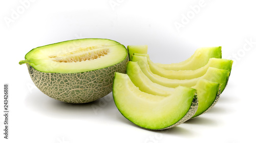 Green melon slices isolated on white background.