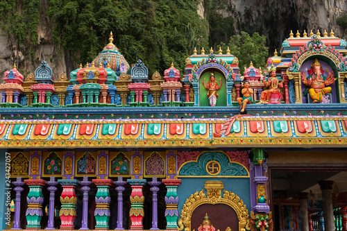 Photography Detail of brightly coloured architecture surrounding the entrance to Temple Cave