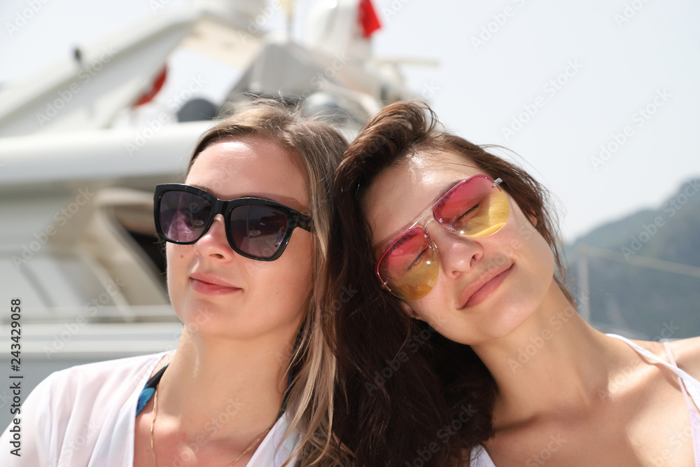 Two beautiful girls near the sea