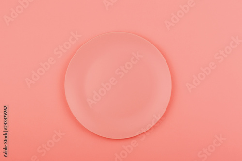 Pink plate on the pink background