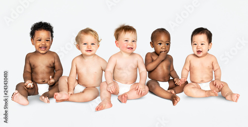 Diverse babies sitting on the floor